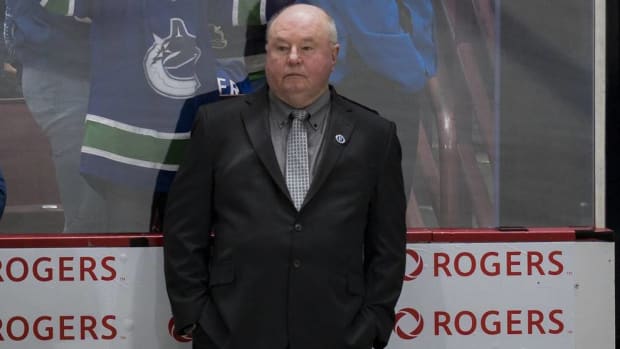 Canucks head coach Bruce Boudreau looks on during a game vs. the Avalanche.
